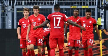 Bayern Munich players celebrate scoring a goal during Bundesliga football match between Borussia Dortmund and Bayern Munich, in Dortmund, Germany, May 26, 2020 (AFP Photo)