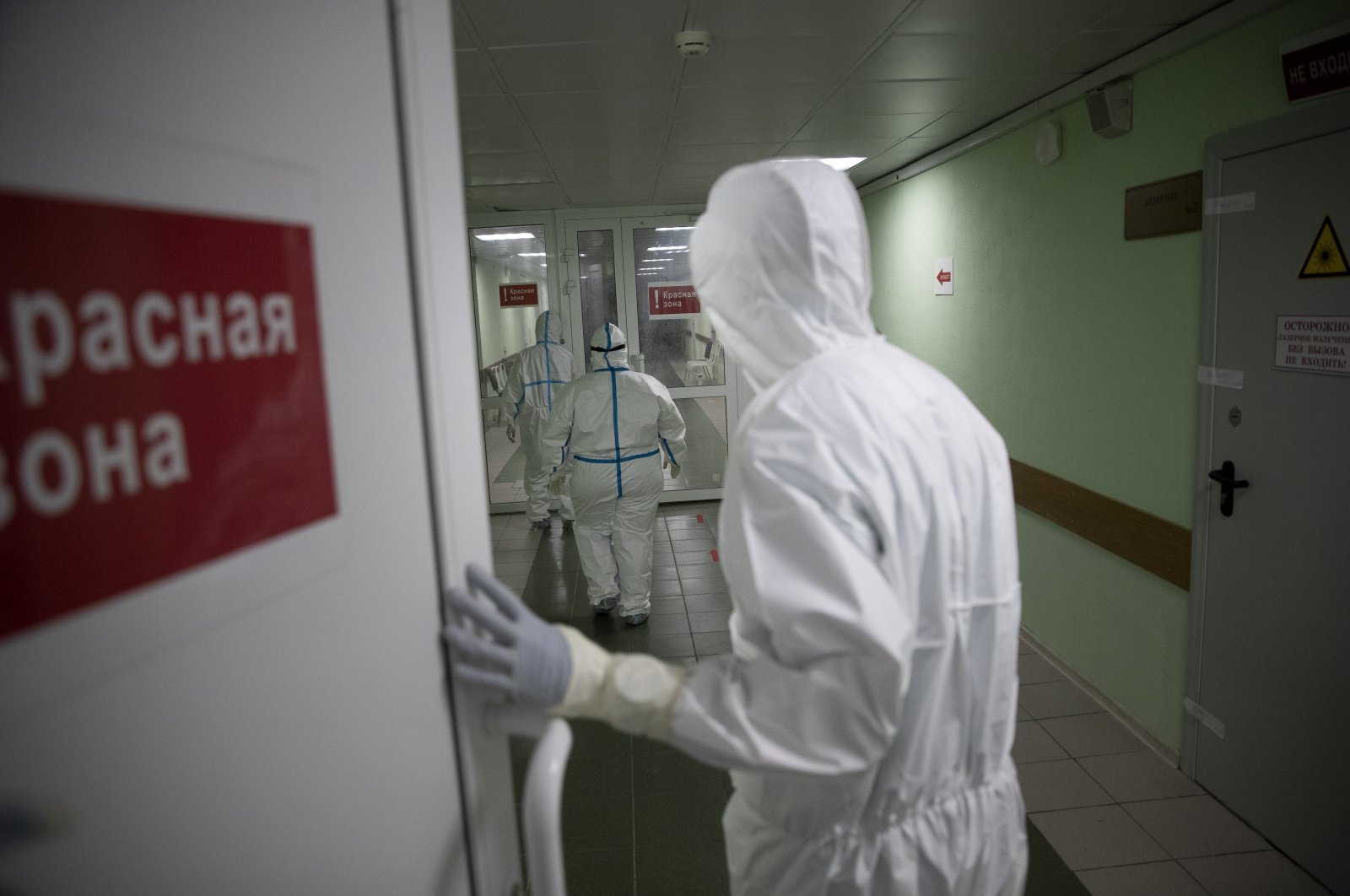 Medics enter a corridor into a red zone of an intensive care unit at Filatov City Clinical Hospital, Moscow, Russia, May 15, 2020. (AP Photo)