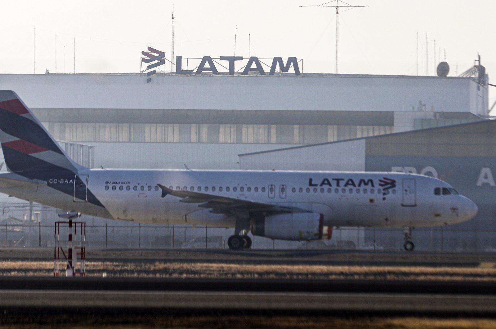 A Latam airplane sits parked at the Arturo Merino Benitez airport in Santiago, Chile, Tuesday, May 26, 2020. (AP Photo)