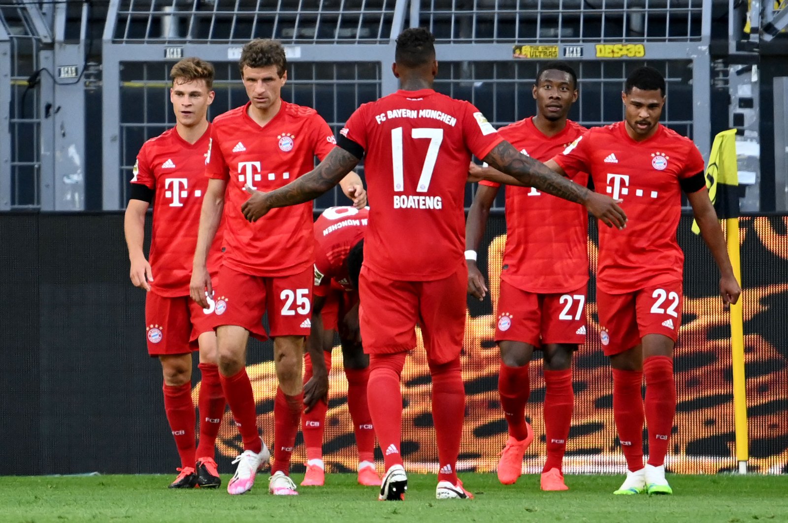 Bayern Munich players celebrate scoring a goal during Bundesliga football match between Borussia Dortmund and Bayern Munich, in Dortmund, Germany, May 26, 2020 (AFP Photo)