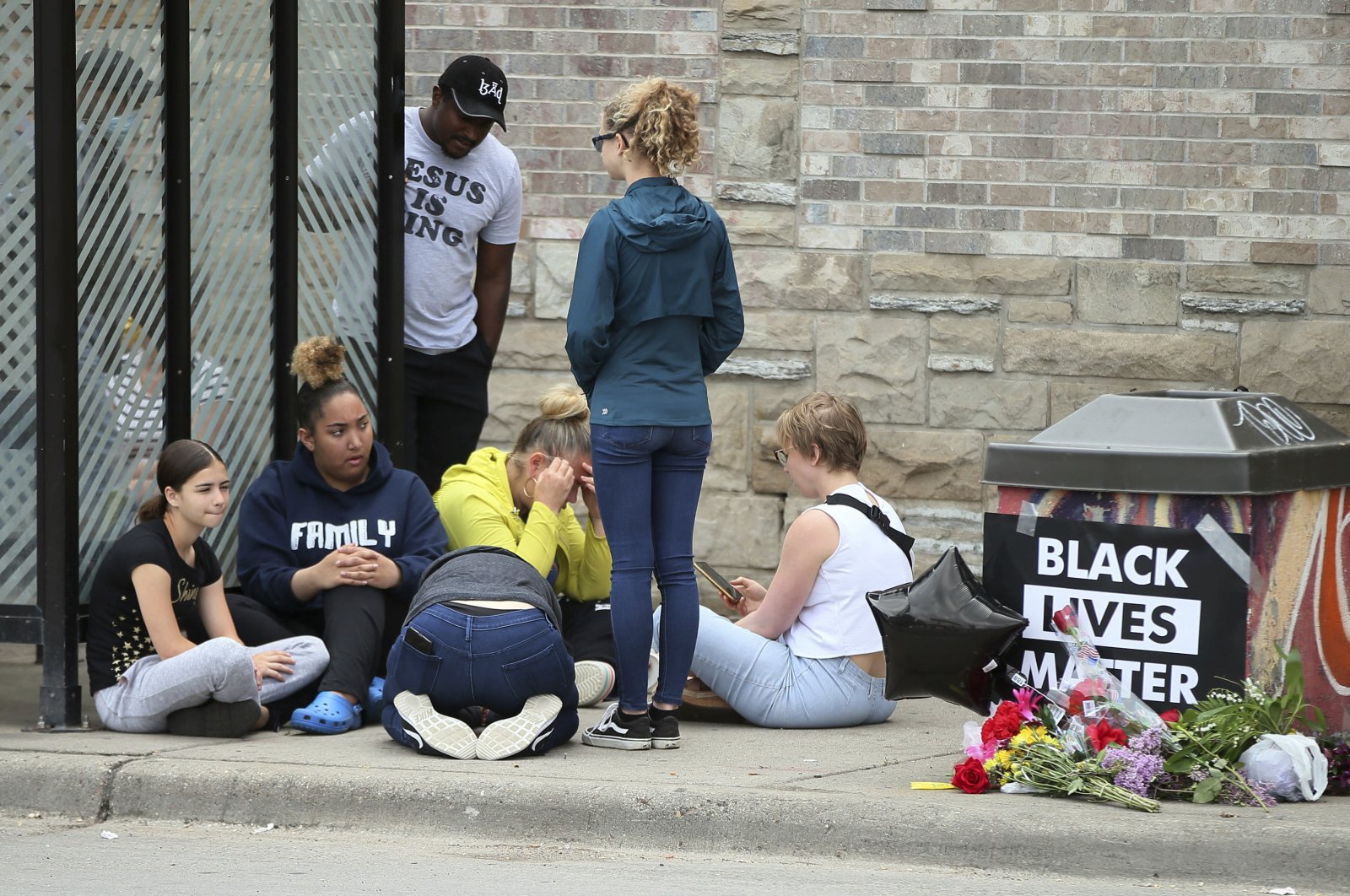 Mourners gather around a makeshift memorial near where a black man was arrested by police and later died, Minneapolis, Minnesota, May 26, 2020. (AP Photo)