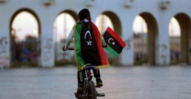 A boy wearing a Libyan flag takes part in a celebration marking the sixth anniversary of the Libyan revolution, in Benghazi, Libya, Feb. 17, 2017. (Reuters Photo)