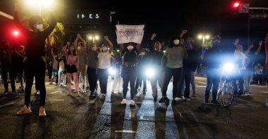 Demonstrators block traffic during a protest over the death of George Floyd in Minneapolis police custody earlier in the week, May 27, 2020, in Los Angeles. (AP Photo)