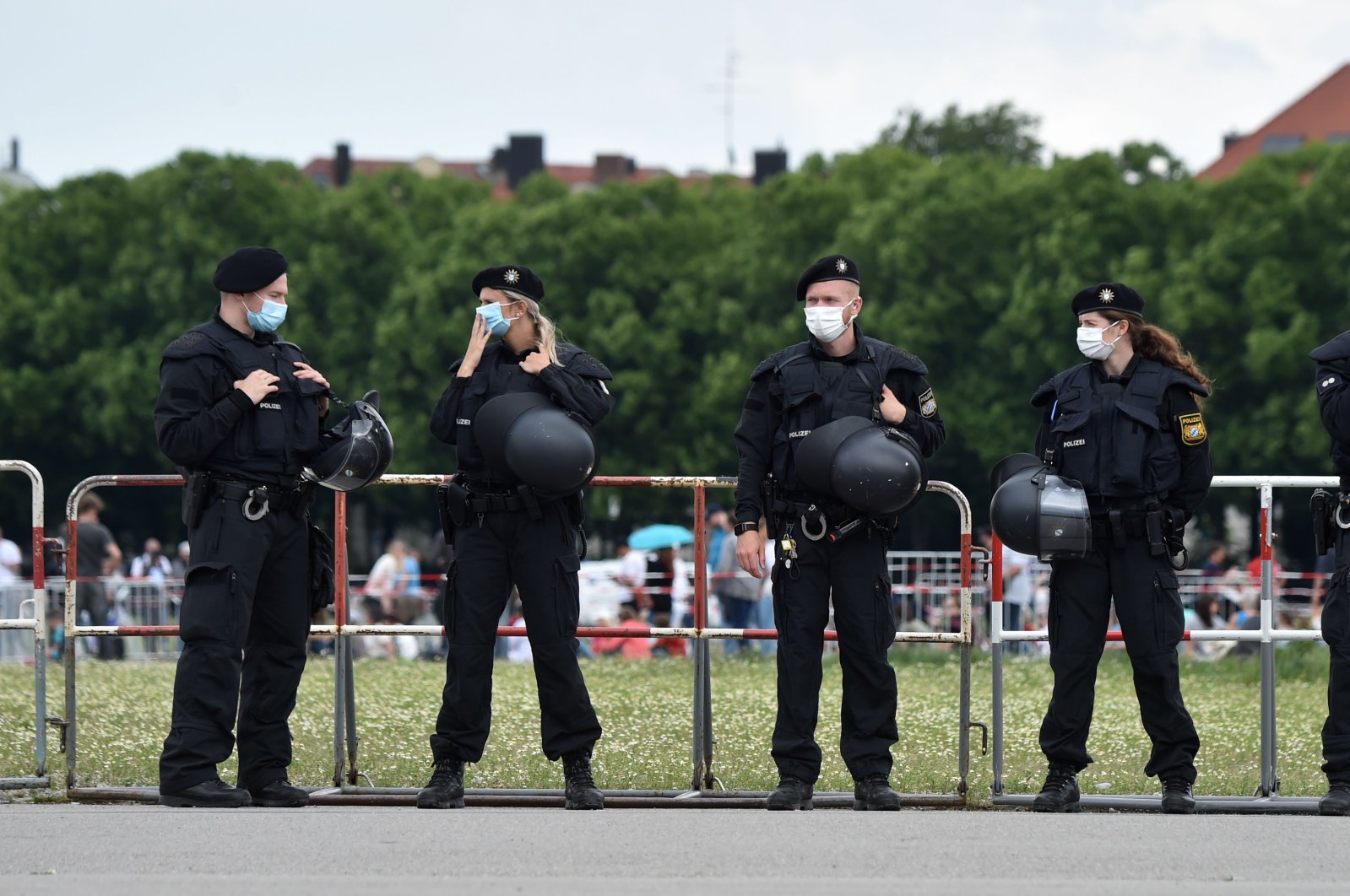 Police officers stand guard in front of a demonstration, Munich, Germany, May 23, 2020. (AFP Photo)