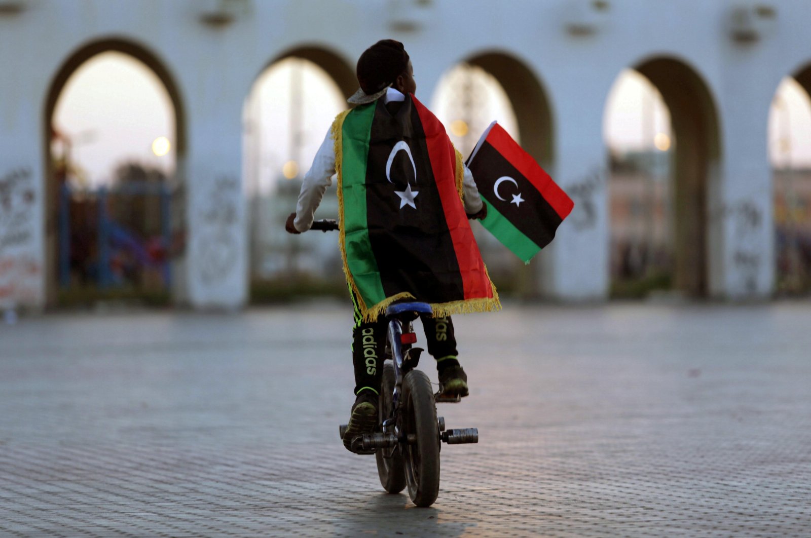 A boy wearing a Libyan flag takes part in a celebration marking the sixth anniversary of the Libyan revolution, in Benghazi, Libya, Feb. 17, 2017. (Reuters Photo)