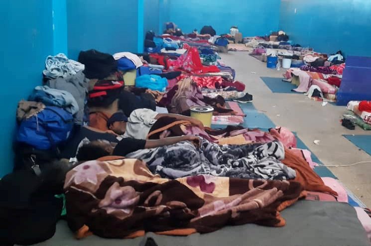 Migrants resting on the floor of a detention centre, amidst concerns over the spread of the coronavirus disease in the city of Zawiya, Libya May 5, 2020. REUTERS/Stringer