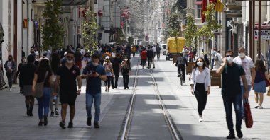 People walk along Istiklal Street near Taksim Square, Istanbul, Turkey, May 15, 2020. (AP Photo)