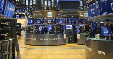 In this photo provided by the New York Stock Exchange, employees work on the partially reopened trading floor, Tuesday, May 26, 2020. (Courtney Crow/New York Stock Exchange via AP)
