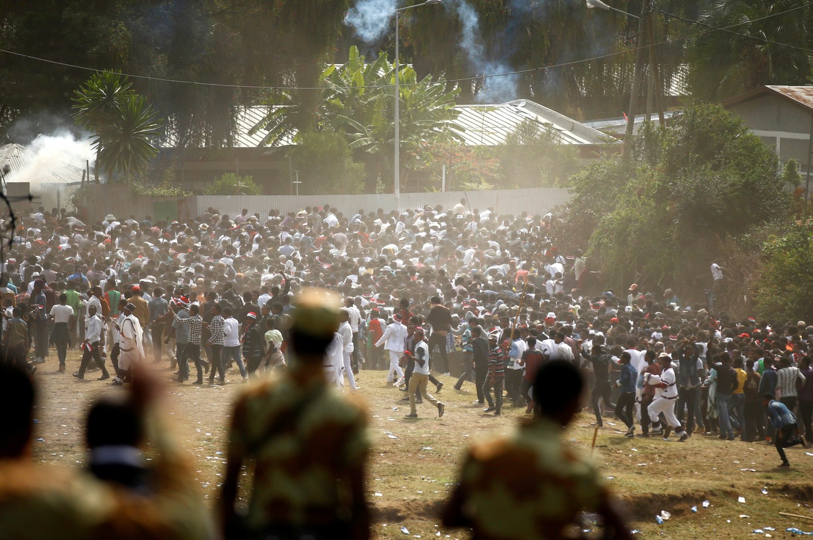 Protestors run from teargas launched by security personnel during the Irecha, the thanksgiving festival of the Oromo people, Bishoftu, Oromia region, Ethiopia, Oct. 2, 2016. (Reuters Photo)