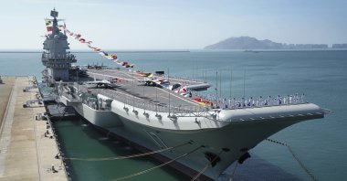 In this Dec. 17, 2019, file photo provided by Xinhua News Agency, the Shandong aircraft carrier is docked at a naval port in Sanya in southern China's Hainan Province. (Xinhua via AP)