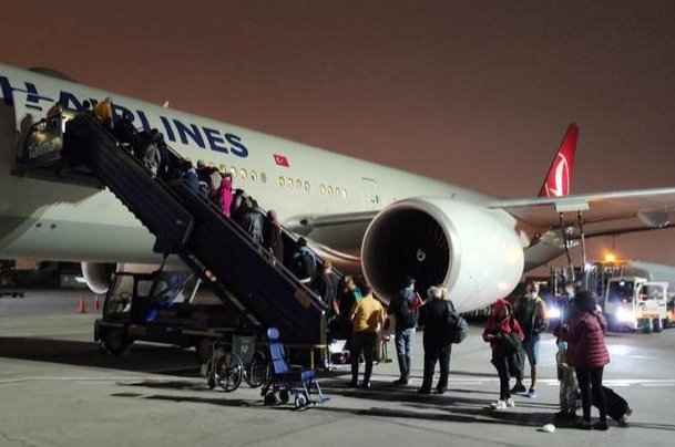 Photo shared by the German Federal Foreign Office's Twitter account shows German and Turkish citizens boarding a Turkish Airlines evacuation plane on Monday, May 25, 2020.