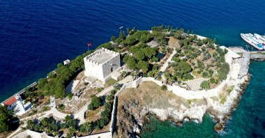 An aerial photo of the Güvercinada Castle on the island. (AA Photo)