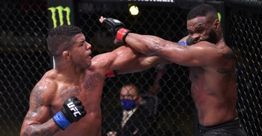 Gilbert Burns, left, punches Tyron Woodley UFC Fight Night, Las Vegas, U.S., May 30, 2020. (Reuters Photo)