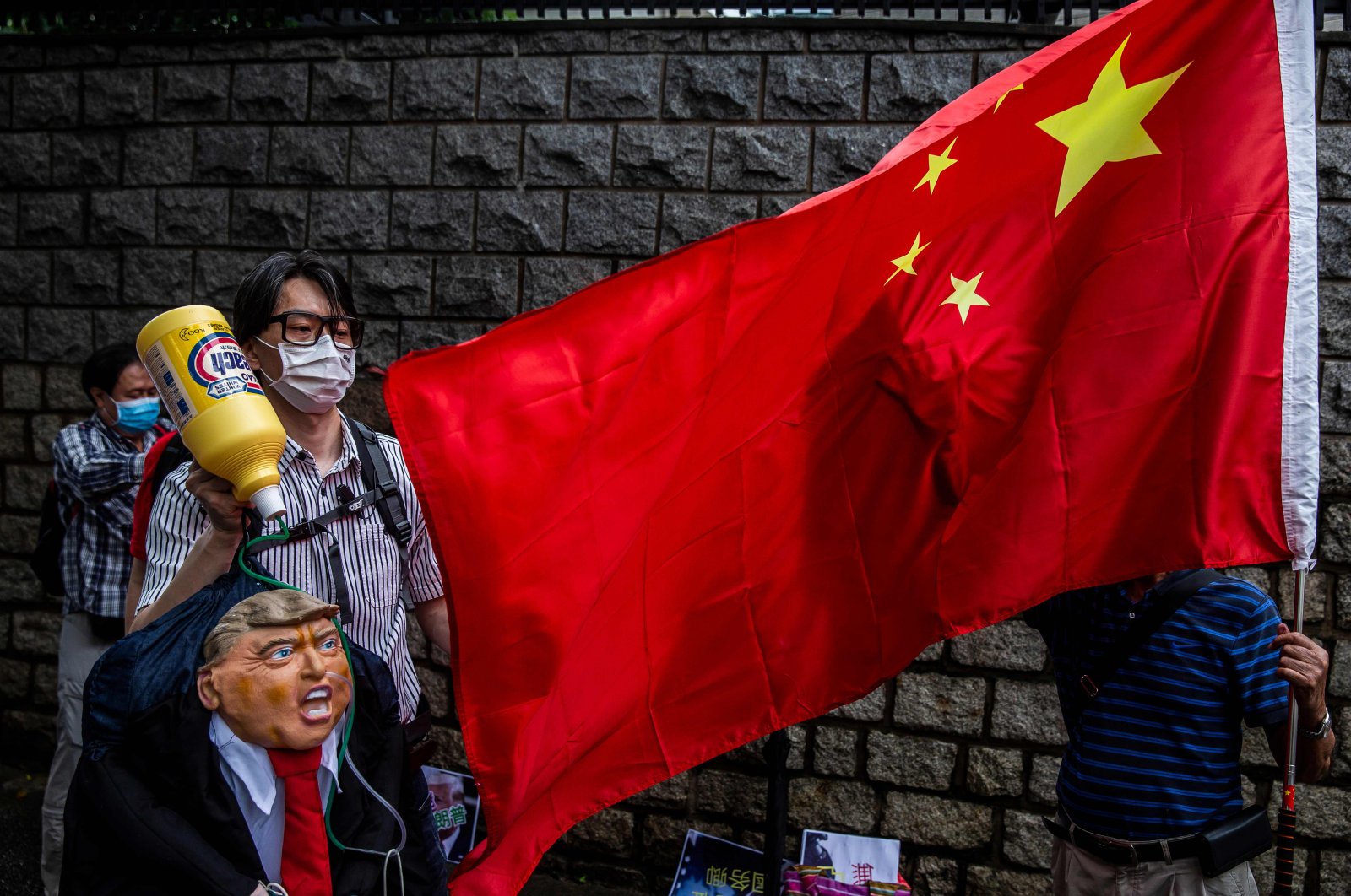 A pro-China activist holds an effigy of U.S. President Donald Trump during a protest outside the U.S. consulate in Hong Kong, May 30, 2020. (AFP Photo)