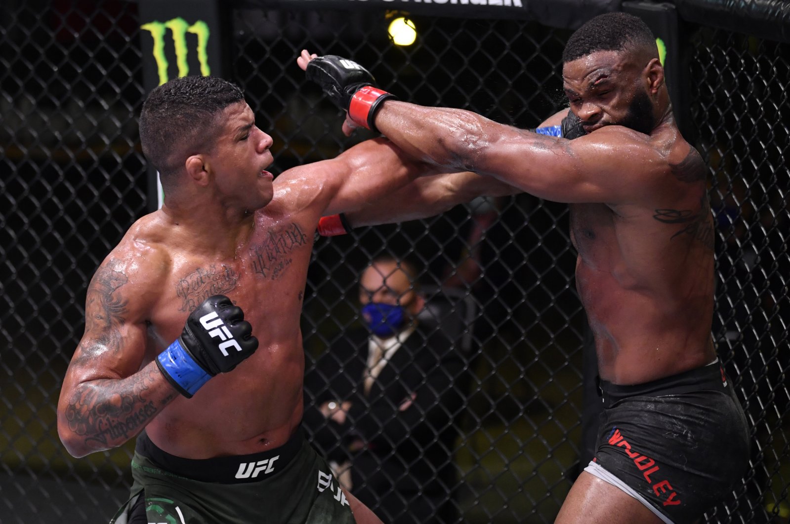 Gilbert Burns, left, punches Tyron Woodley UFC Fight Night, Las Vegas, U.S., May 30, 2020. (Reuters Photo)