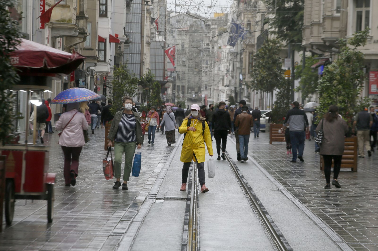 People walk on Istiklal Street in Taksim, Istanbul, Wednesday, May 27, 2020. (AA Photo)