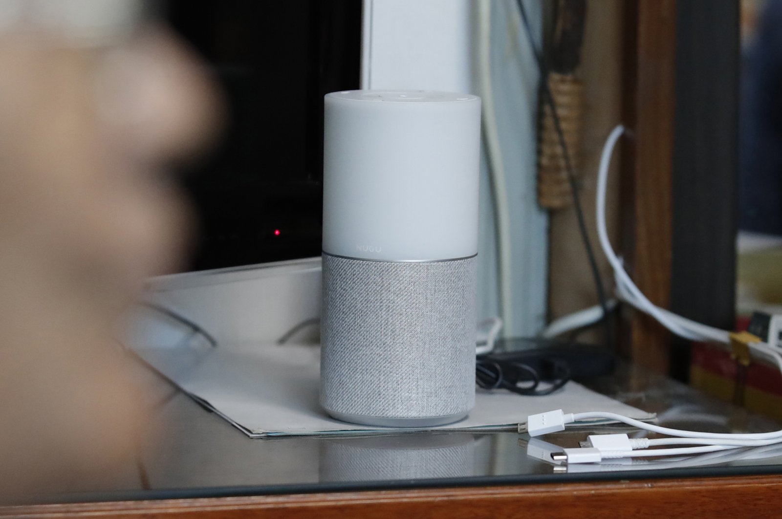 SK Telecom's AI speaker Nugu built with an artificial intelligence called "Aria" and a lamp that turns blue when processing voice commands for news, music and internet searches, is seen at a senior citizen's home in Seoul, South Korea, on May 13, 2020. (AP Photo)