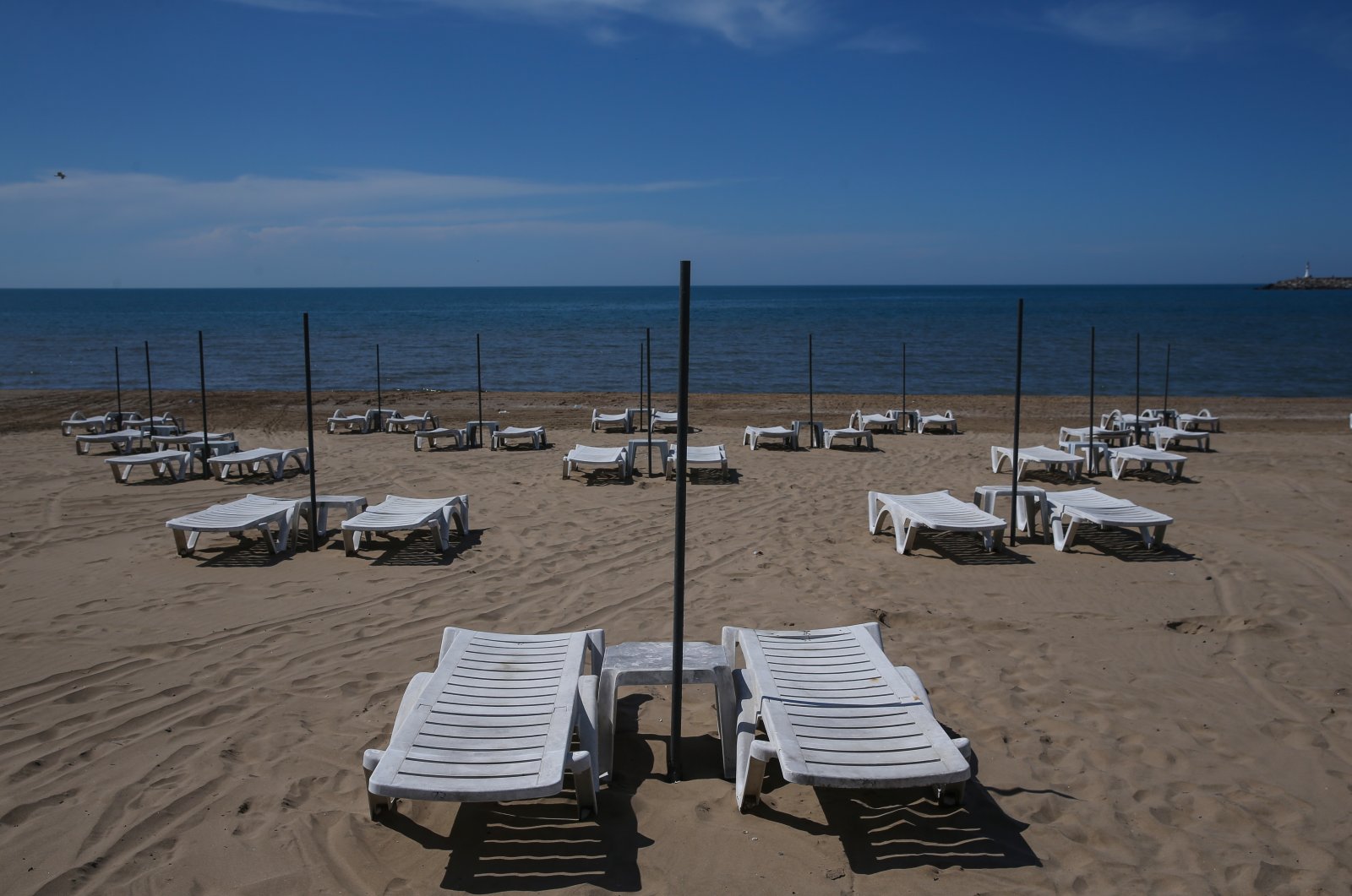 Lounge chairs are arranged at an appropriate distance from one another at a beach in Şile in preparation to reopen to the public following a monthslong closure due to the coronavirus outbreak, Istanbul, Turkey, May 31, 2020. (AA Photo)