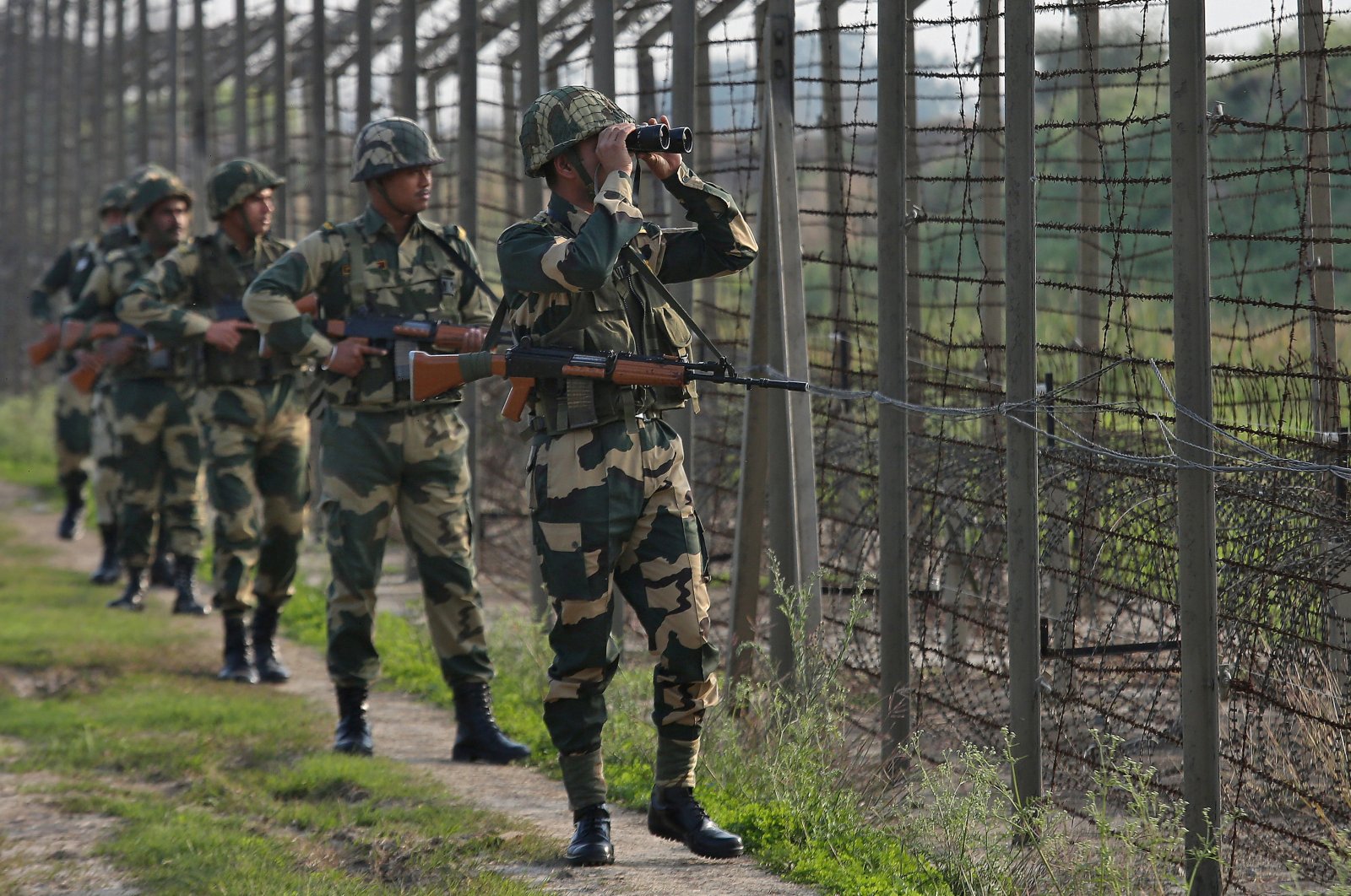 India's Border Security Force soldiers patrol along the fenced border with Pakistan in the Ranbir Singh Pura sector near Jammu, Feb. 26, 2019. (Reuters Photo)