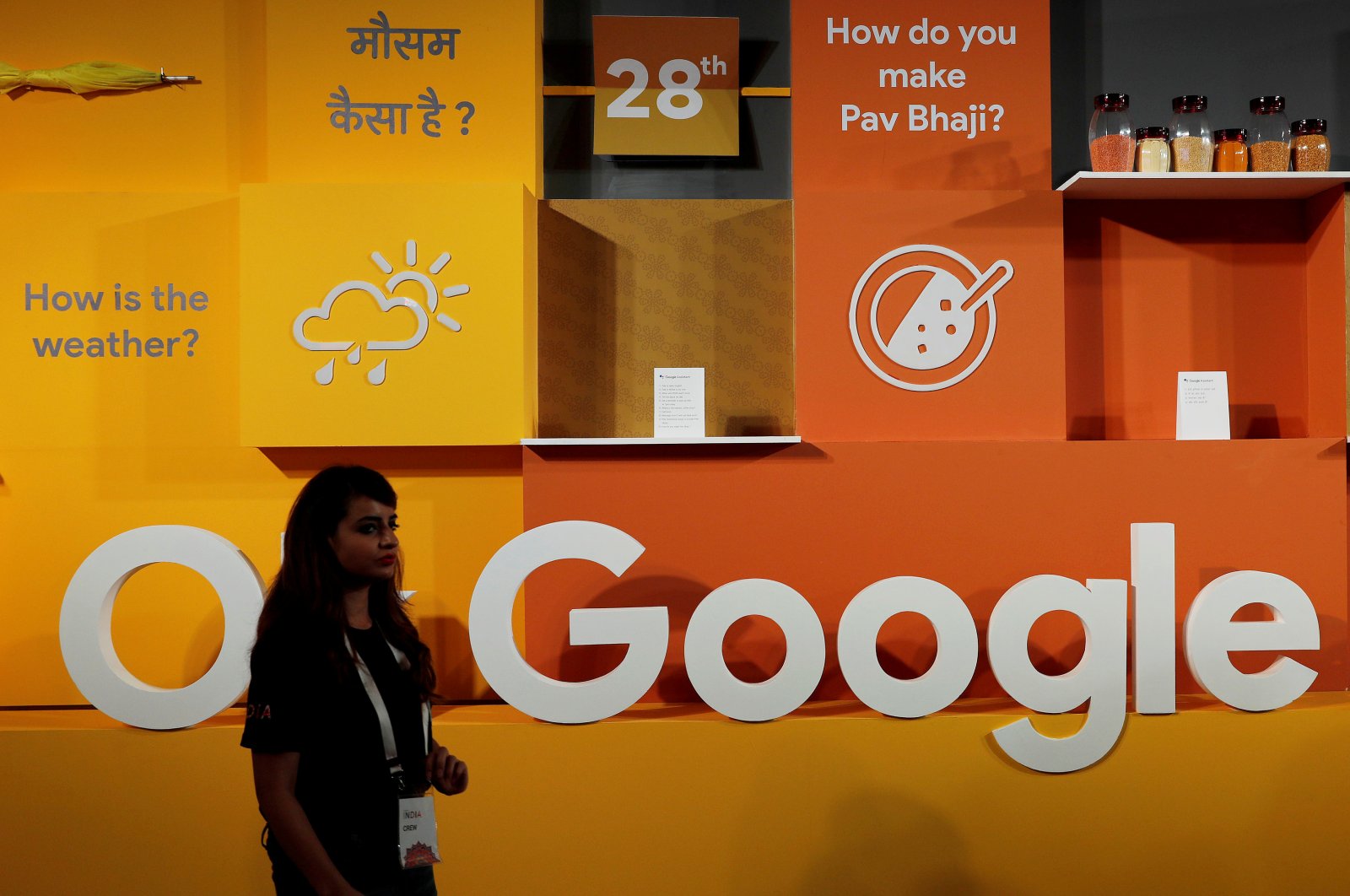 A woman walks past the logo of Google during an event in New Delhi, India, Aug. 28, 2018. (Reuters Photo)