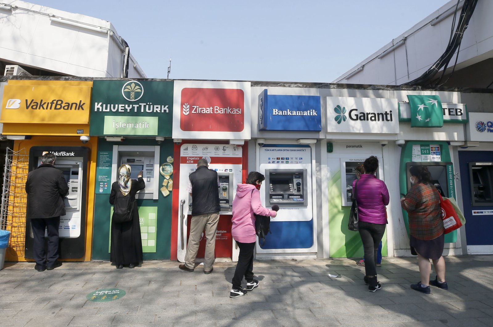 Customers use ATM machines in Istanbul's Üsküdar district, April 27, 2020