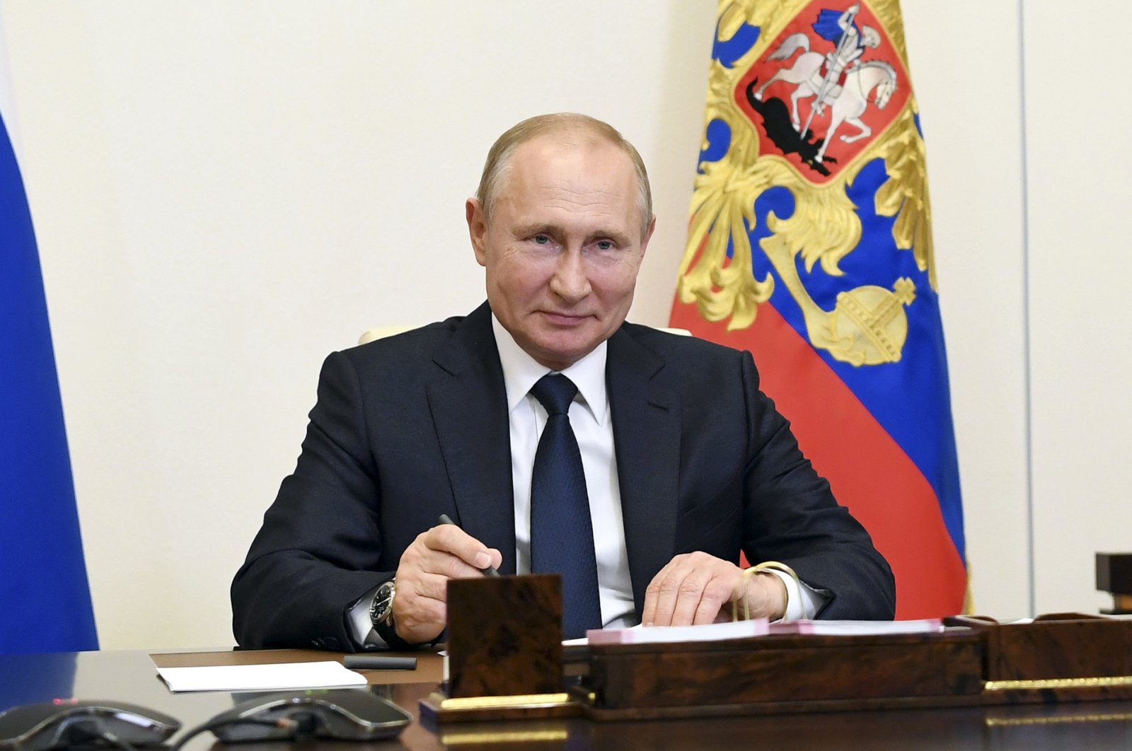 Russian President Vladimir Putin attends a meeting via teleconference at the Novo-Ogaryovo residence outside Moscow, Russia, June 1, 2020. (Kremlin Pool Photo via AP)