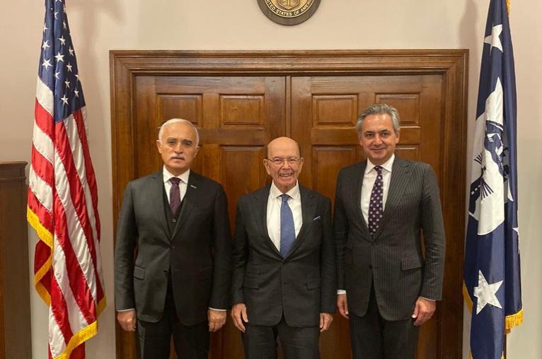 Foreign Economic Relations Board of Turkey (DEIK) Chairman Nail Olpak (L) and Turkey-U.S. Business Council (TAIK) Chairman Mehmet Ali Yalçındağ (R) pose with the U.S. Secretary of Commerce Wilbur Ross after a meeting in Washington, U.S., Nov. 13, 2019.