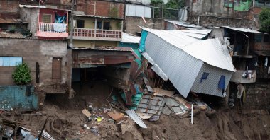A view of houses devastated by the overflowing of a creek due to the torrential rains caused by the passage of tropical storm Amanda, San Salvador, May 31, 2020. (AFP Photo)