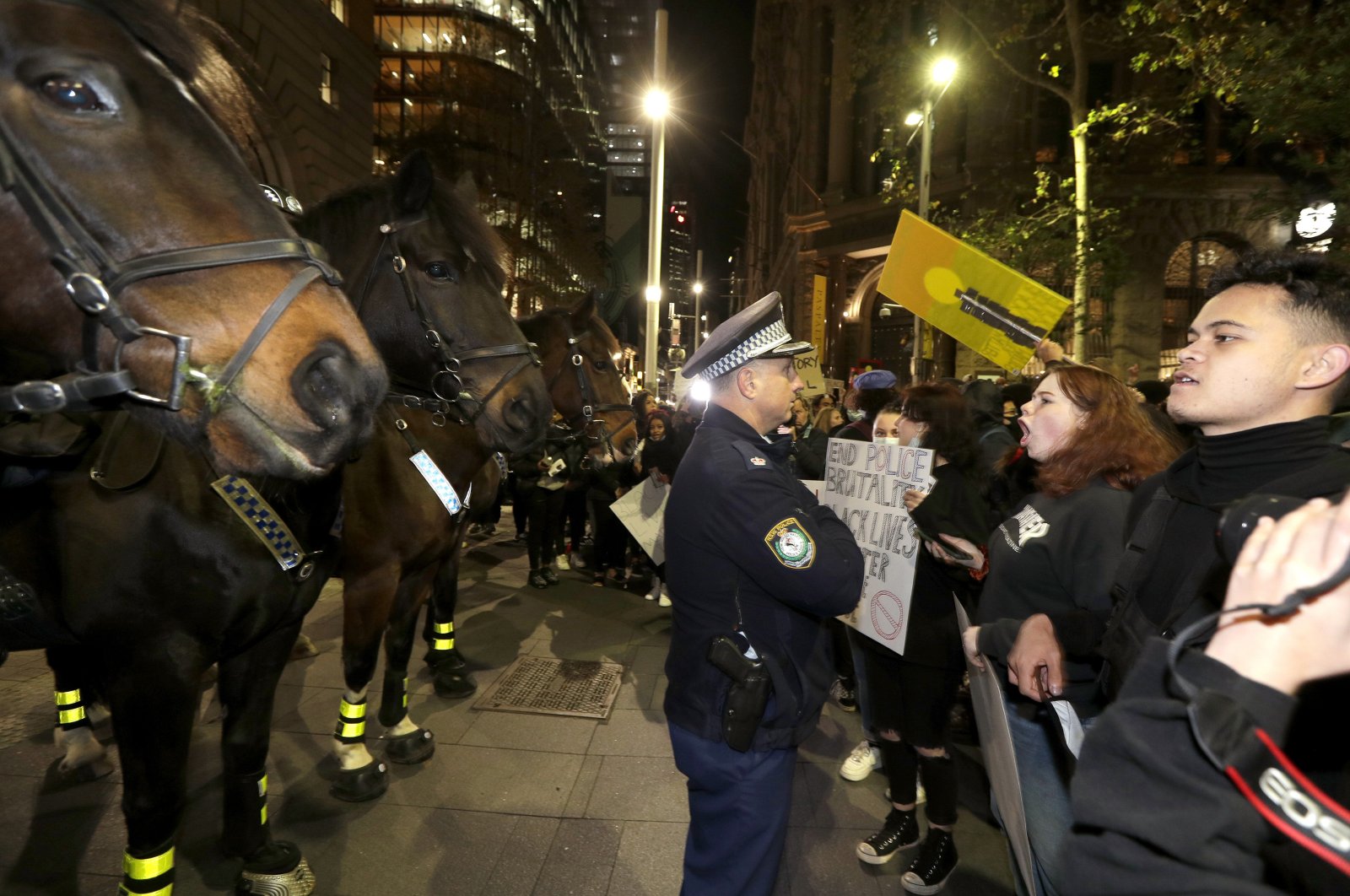 Protesters approach police on horseback as they gather in Sydney to support the cause of U.S. protests over the death of George Floyd, June 2, 2020,. (AP Photo)