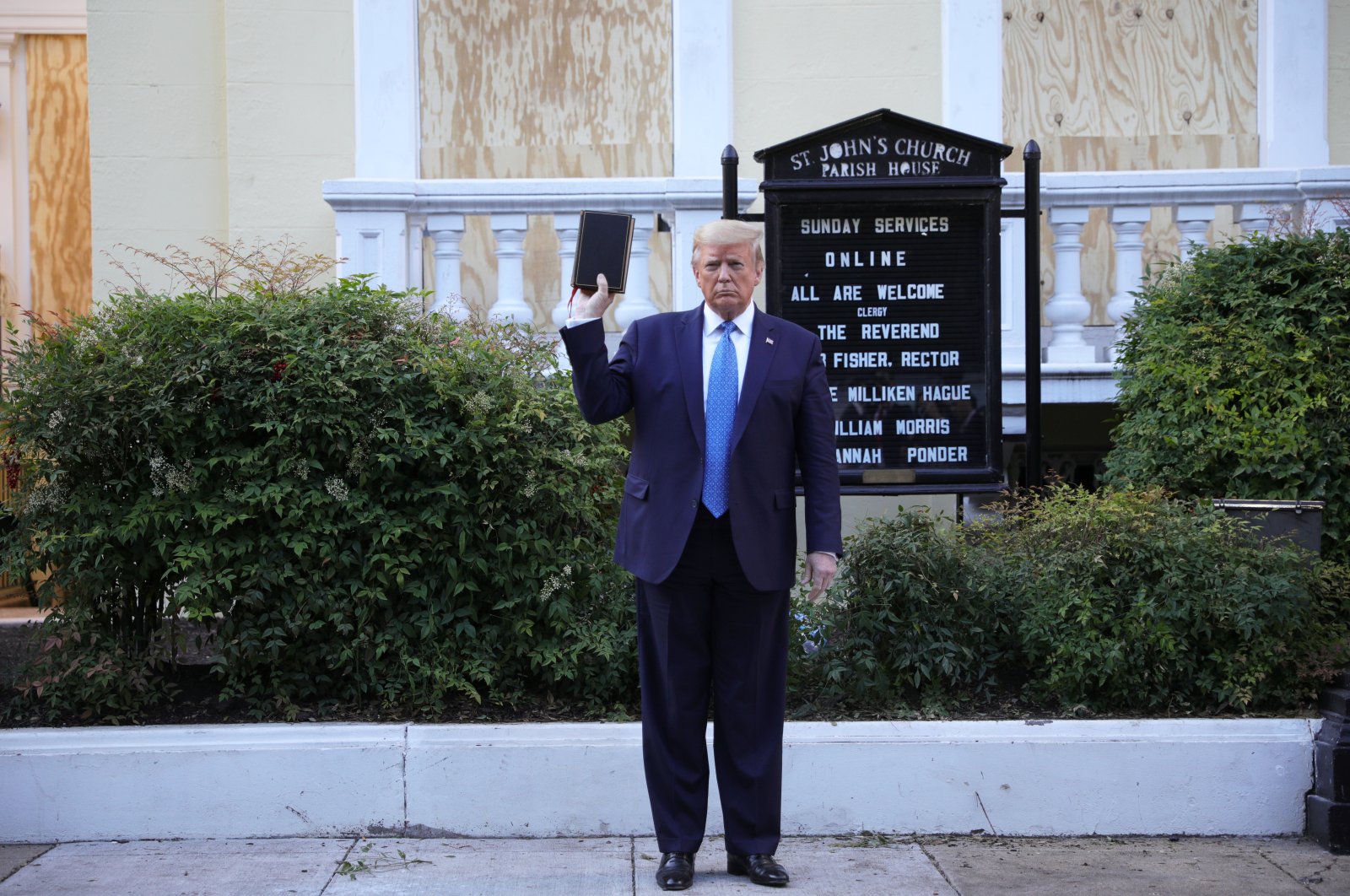 U.S. President Donald Trump holds up a Bible as he stands in front of St. John's Episcopal Church across from the White House after walking there for a photo opportunity during ongoing protests over racial inequality in the wake of the death of George Floyd while in Minneapolis police custody, at the White House in Washington, U.S., June 1, 2020. (Reuters Photo)