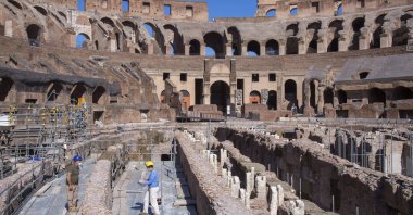 Restorers work inside the Colosseum in Rome, June 1, 2020. (AP Photo)