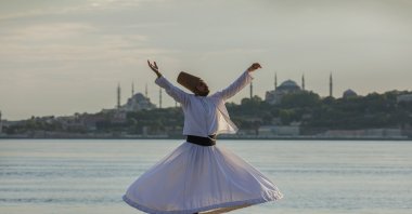 In the video clip, whirling dervish Ismail Ecevit performs his show with a backdrop of Istanbul's iconic sites. (AA Photo)