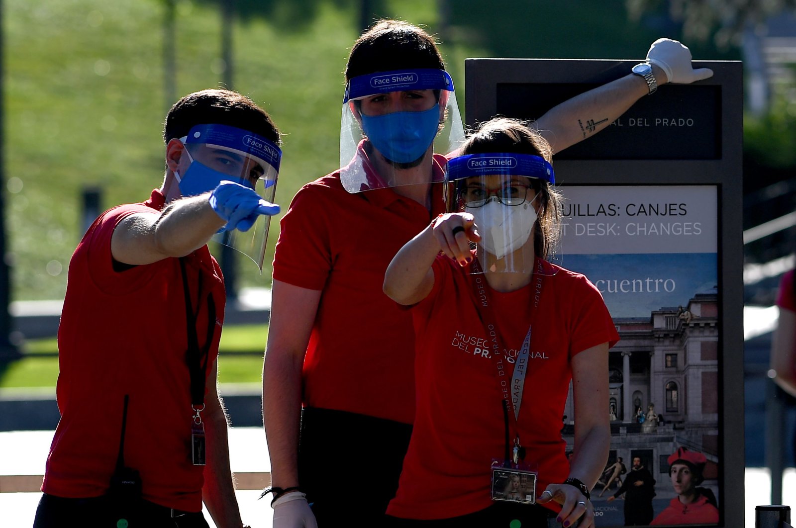 Employees wearing face masks and shields place information panels outside The Prado Museum in Madrid, on June 6, 2020. (AFP Photo)