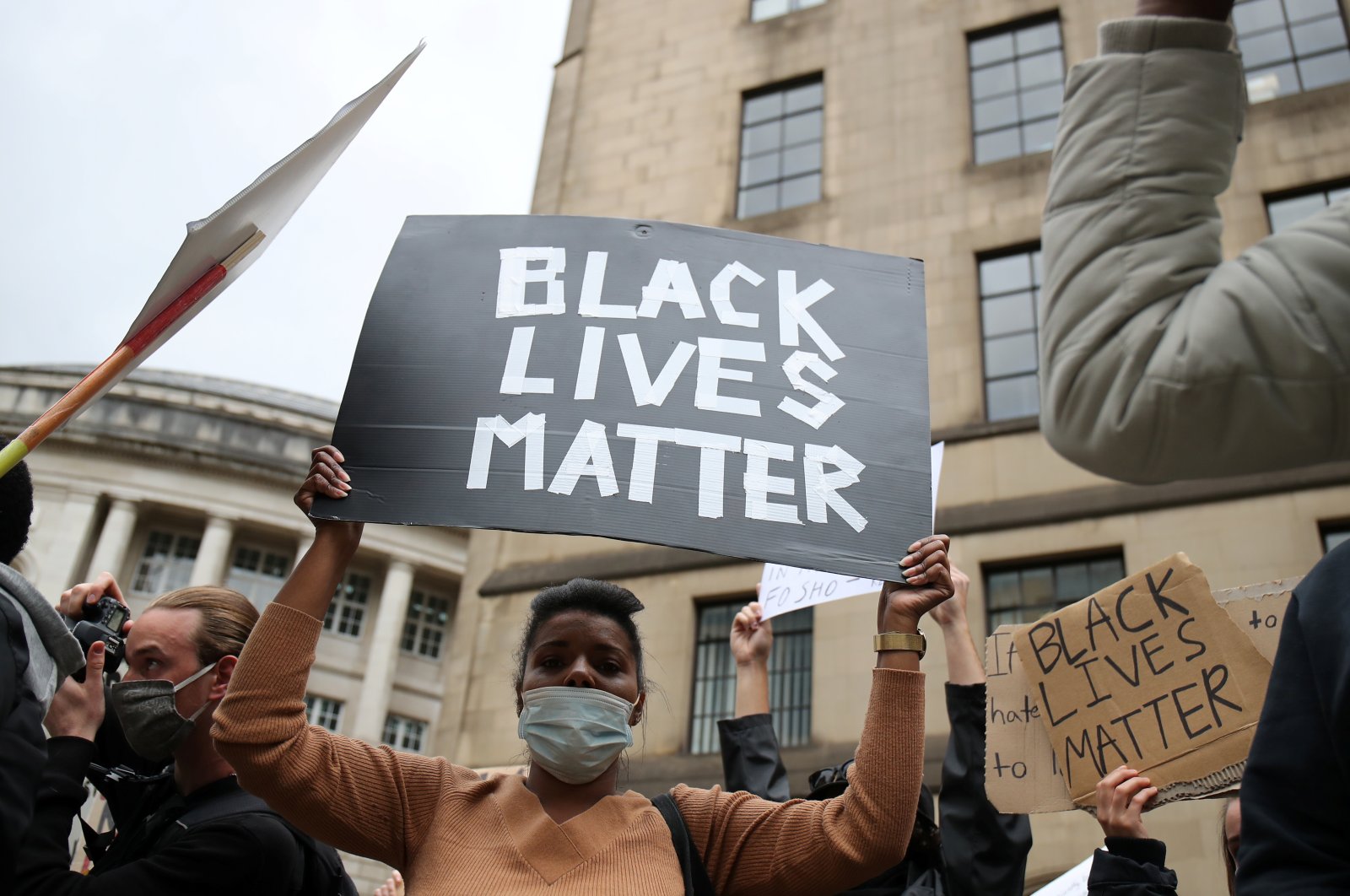 A demonstrator holds a sign during a Black Lives Matter protest in Manchester, following the death of George Floyd who died in police custody in Minneapolis, Manchester, Britain, June 7, 2020. (Reuters Photo)