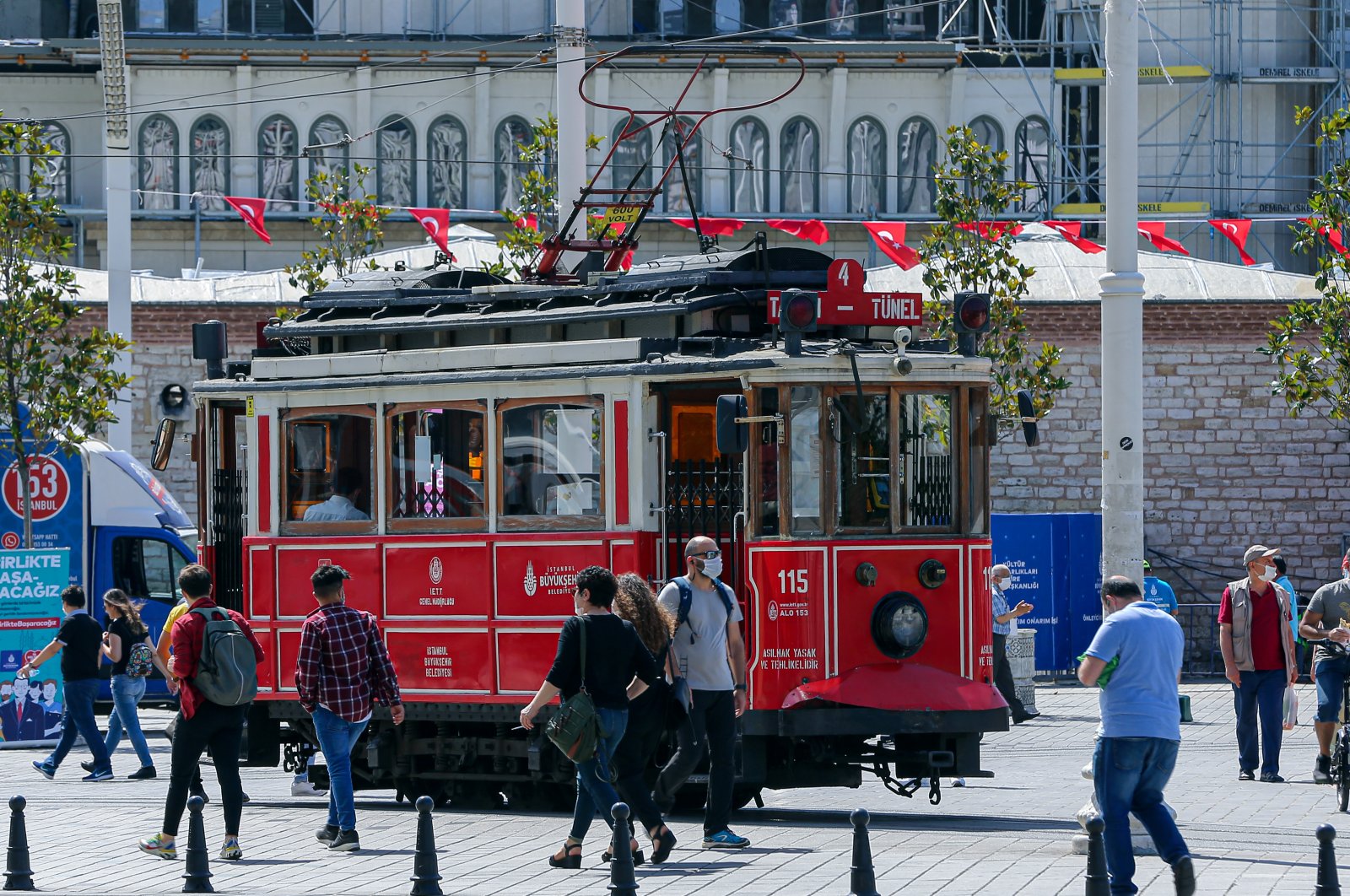 Pedestrians walk in Taksim Square, Istanbul, Turkey, June 6, 2020. (AA Photo)