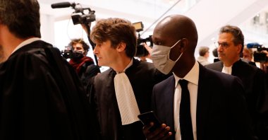 Habib Cisse (R), Diack's former legal advisor, arrives at a courthouse in Paris for the trial of Lamine Diack (not pictured), former head of the International Association of Athletics Federations (now World Athletics), on charges of accepting millions of dollars to cover up Russian doping tests, June 8, 2020. (AFP Photo)