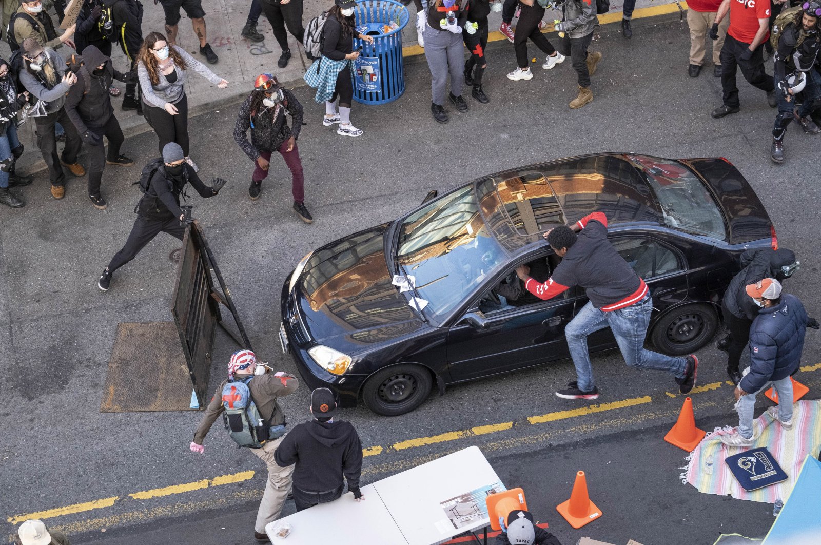 A man drives into the crowd at 11th and Pike, injuring at least one person, Seattle, June 7, 2020. (AP Photo)