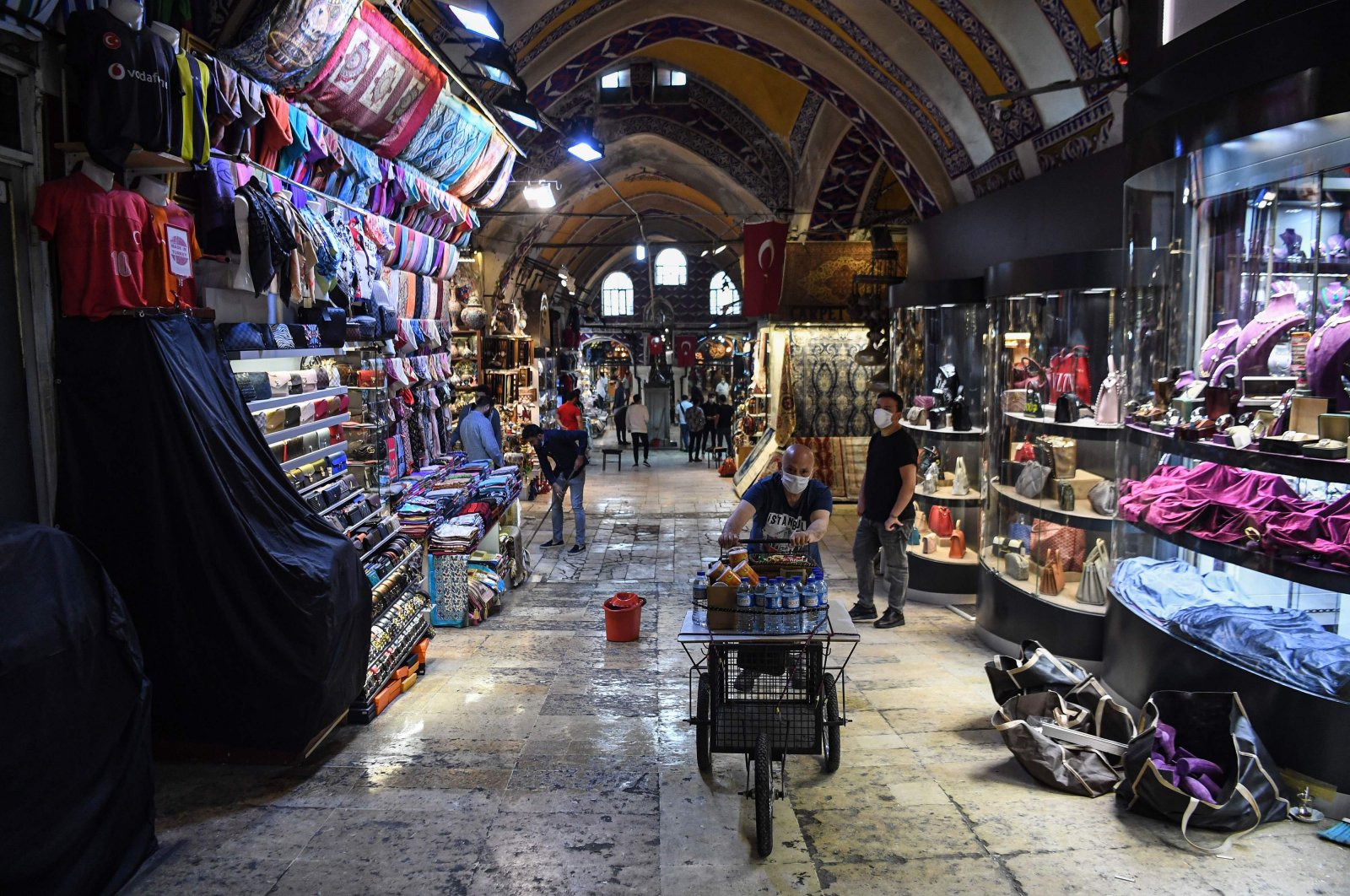 Shop owners wearing protective face masks work at Istanbul's iconic Grand Bazaar, Turkey, June 1, 2020. (AFP Photo)
