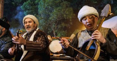 Still shot shows Arslanbek Sultanbekov (L) performing "Osman Bey" march in the "Kuruluş Osman" series. 