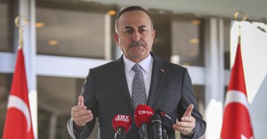 Foreign Minister Mevlüt Çavuşoğlu speaks to the media in Ankara, Turkey, March 25, 2020. (AP Photo)