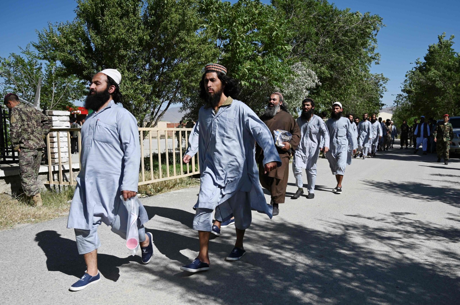 Taliban prisoners walk in line during their release from the Bagram prison, next to the U.S. military base, Bagram, Afghanistan, May 26, 2020. (AFP Photo)