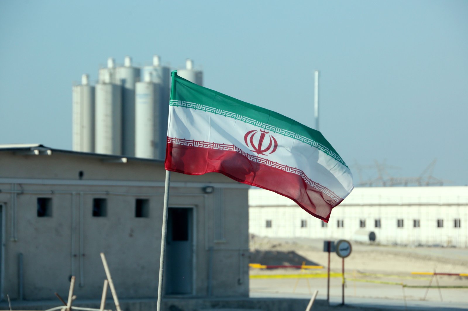 An Iranian flag at Iran's Bushehr nuclear power plant during an official ceremony to kick-start work on a second reactor at the facility, Nov. 10, 2019. (AFP Photo)