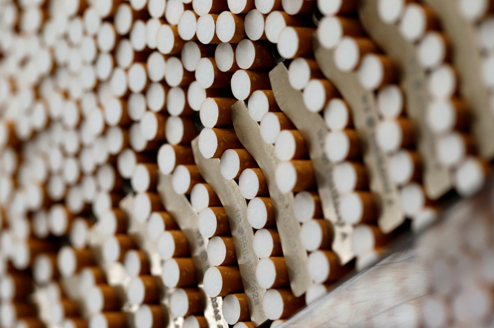 Cigarettes are seen during the manufacturing process in the British American Tobacco Cigarette Factory (BAT) in Bayreuth, southern Germany, April 30, 2014. (Reuters Photo)