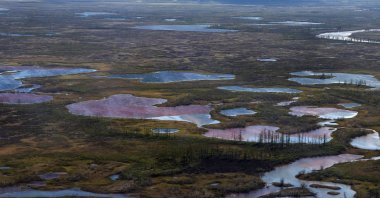 An aerial view shows the pollution in a river outside Norilsk on June 6, 2020. (AFP Photo)