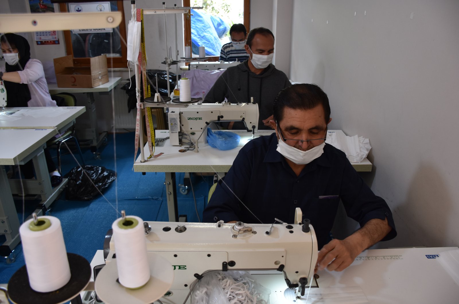 Musa Hüseyni sews a mask in a workshop, in Trabzon, Turkey, June 10, 2020. (AA Photo)