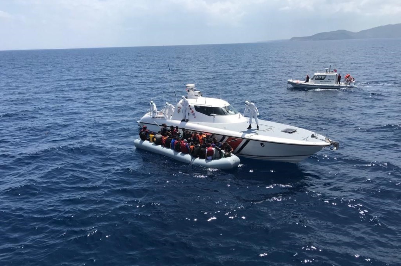 Turkey's Coast Guard Command has rescued hundreds of migrants and asylum-seekers off the Aegean coast after they were forced by Greece into Turkish territorial waters. (AA Photo)