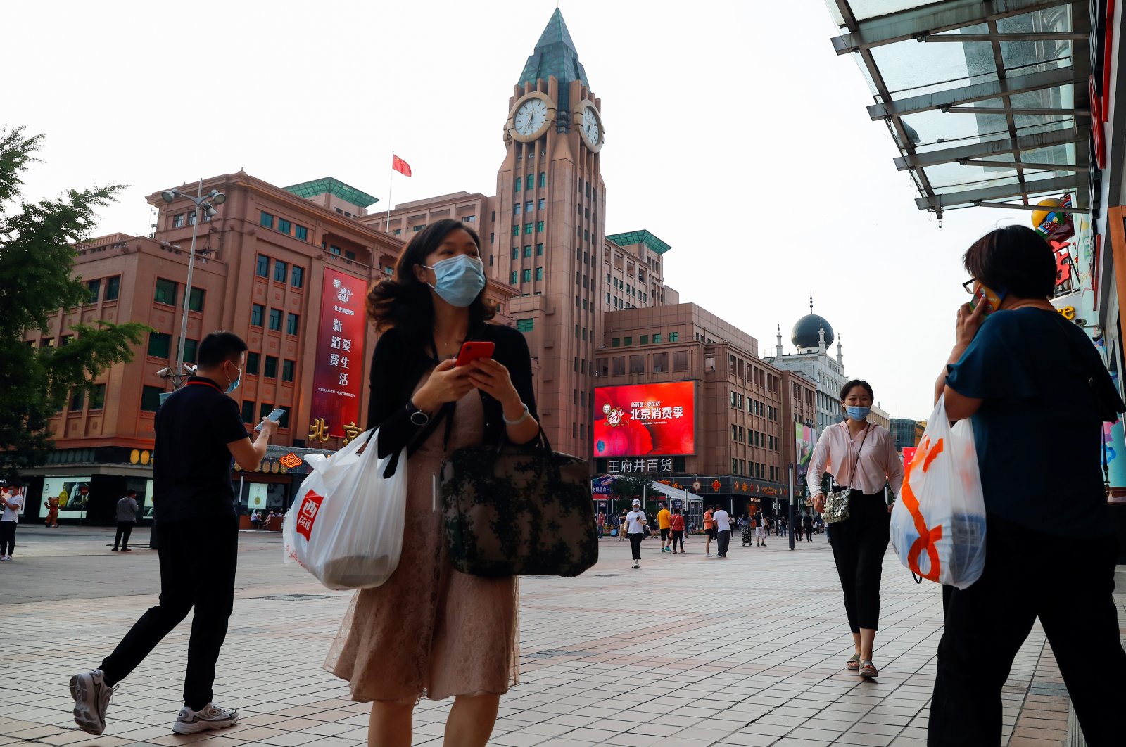 People walk past a department store of the Wangfuijing Group in Beijing, China, June 10, 2020. (Reuters Photo)
