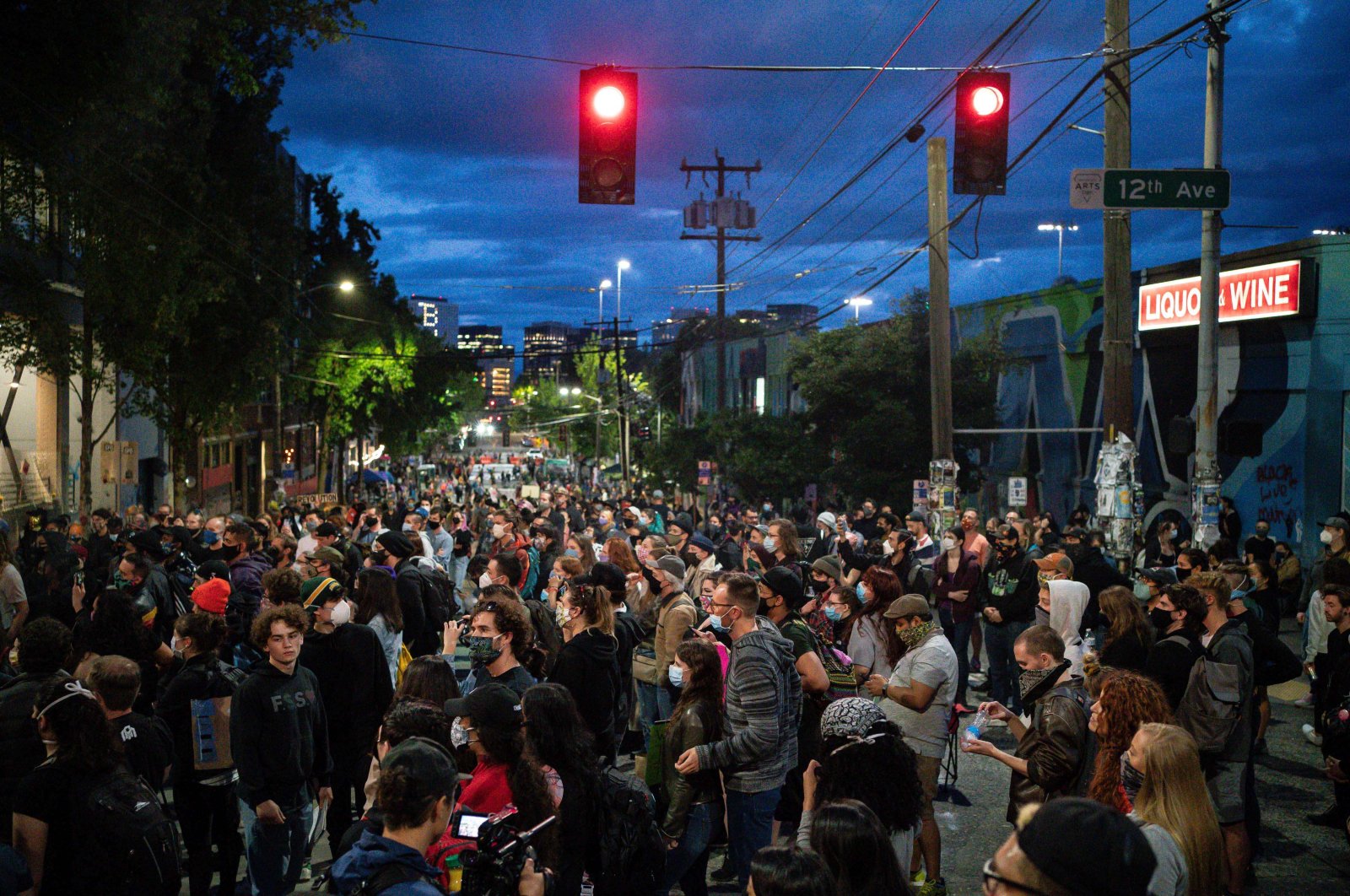 People listen as a band plays a free show in front of the Seattle Police Departments East Precinct in the so-called "Capitol Hill Autonomous Zone," Seattle, U.S., June 10, 2020. (AFP Photo)