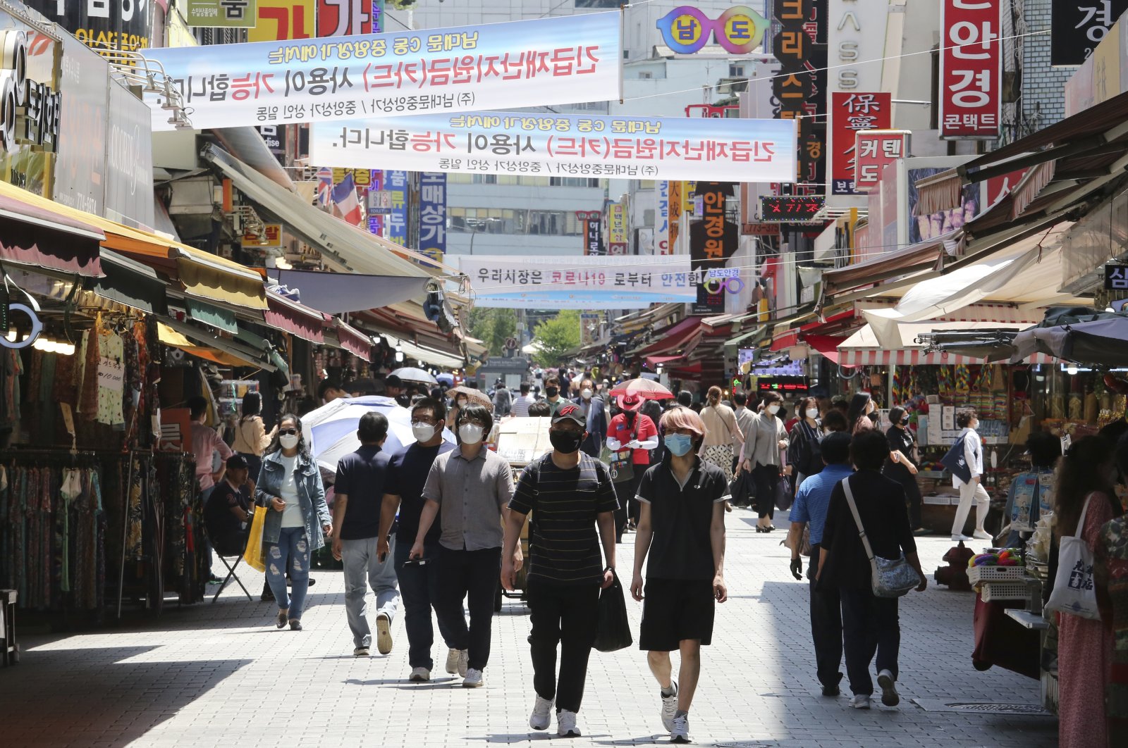 People walk in a shopping district in Seoul, South Korea, June 11, 2020. (AP Photo)