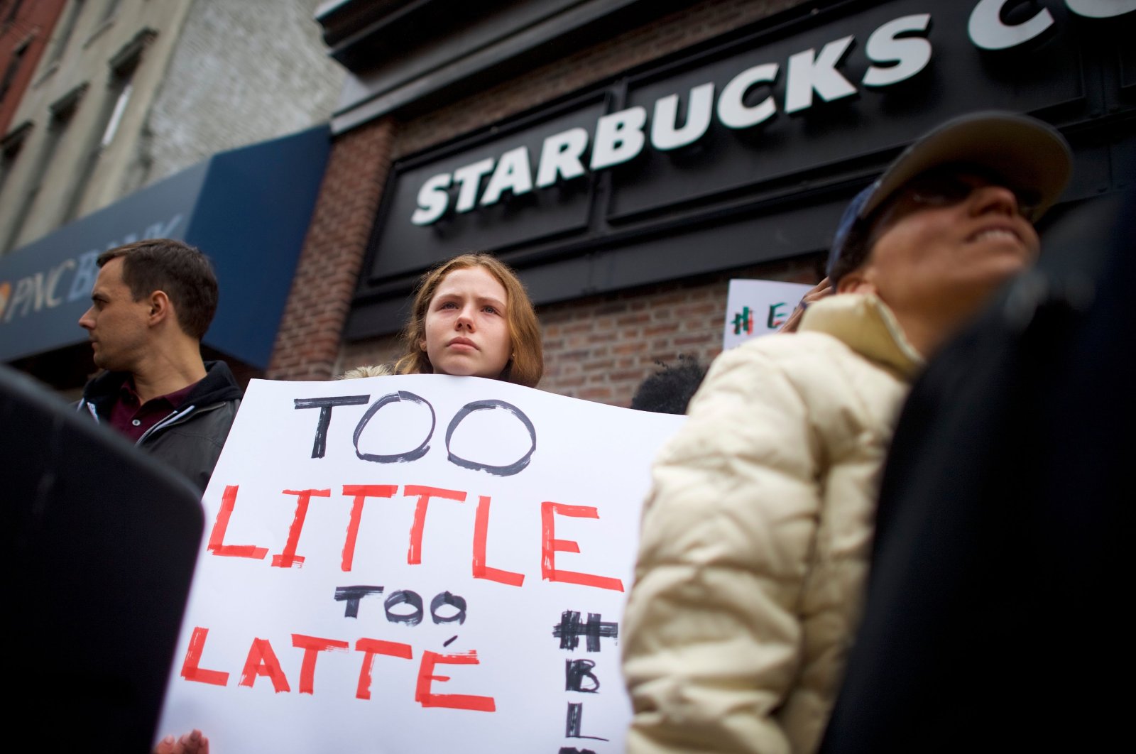  In this file photo taken on April 15, 2018, protesters demonstrate outside a Starbucks in Philadelphia, Pennsylvania. (AFP Photo)